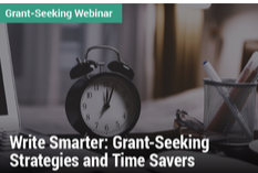 Grant-Seeking Webinar: Write Smarter: Grant-Seeking Strategies and Time Savers - Image of a clock on a desk