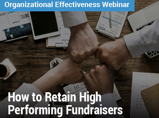Organizational Effectiveness Webinar: How to Retain High Performing Fundraisers - image of four people fist-bumping over a table full of papers and supplies